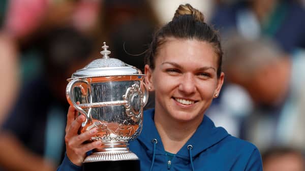 FILE PHOTO: Romania’s Simona Halep celebrates with the French Open trophy at Roland Garros, Paris, France – June 9, 2018