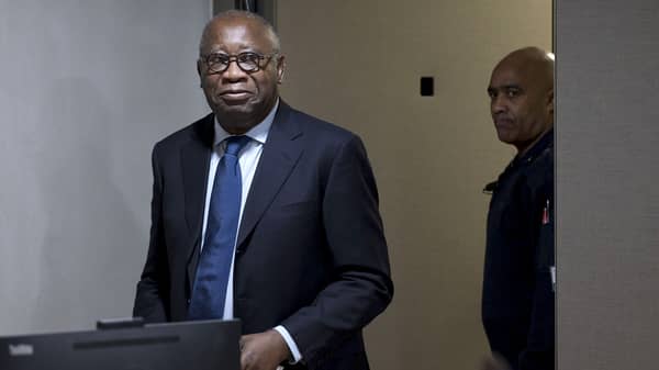 Former Ivory Coast president Laurent Gbagbo arrives for the start of his trial at the International Criminal Court in The Hague