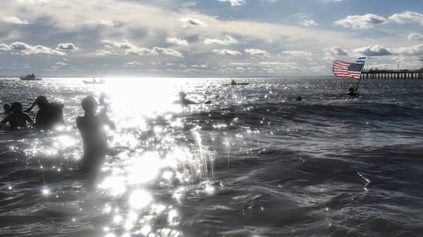 Scores Of Swimmers Take Icy Plunge At Annual Coney Island Polar Bear Club Swim