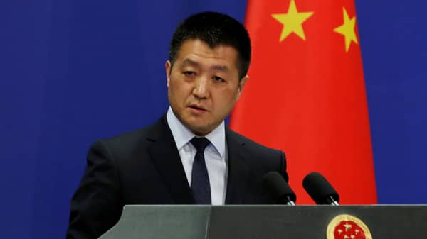 Chinese Foreign Ministry spokesman Lu Kang answers questions about a major bus accident in North Korea, during a news conference in Beijing