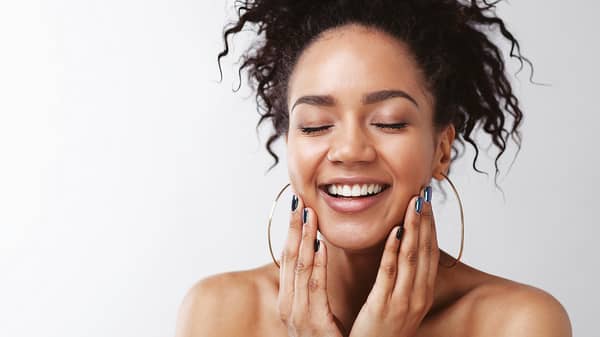Portrait of happy female with her eyes closed