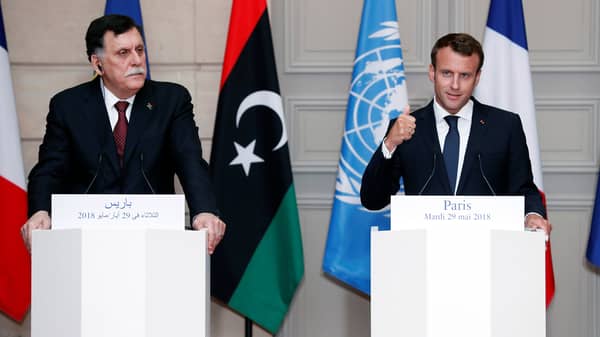 Libyan Prime Minister Fayez al-Sarraj and French President Emmanuel Macron attend a press conference after the International conference on Libya at the Elysee Palace in Paris