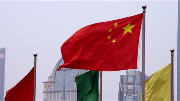 576799049-chinese-flag-blowing-waving-somebody-waving-a-flag-shanghai-city