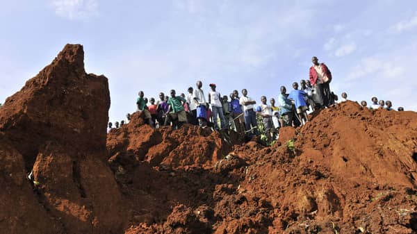 People gather at the scene of a landslide in Nalenda village in Bududa district east of Uganda?s capital Kampala