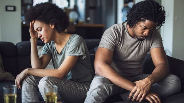 African American couple having problems in their relationship at home.