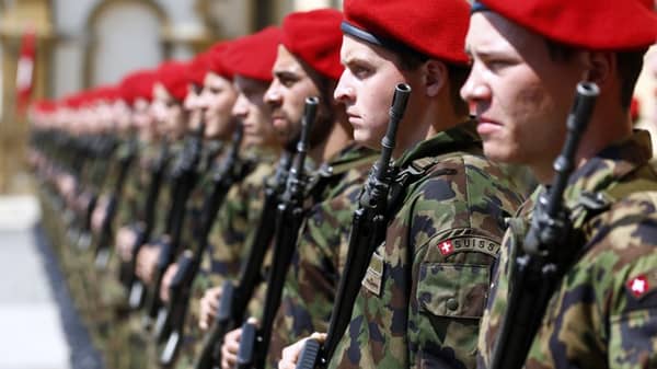 Swiss soldiers line up before the arrival for a meeting of Japan’s Crown Prince Naruhito and Swiss President Burkhalter for a meeting in Neuchatel
