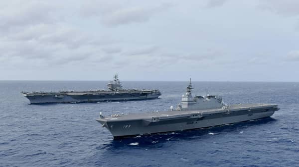 The Navy’s forward-deployed aircraft carrier USS Ronald Reagan operates with the Japan Maritime Self-Defense Force helicopter carrier JS Izumo in South China Sea