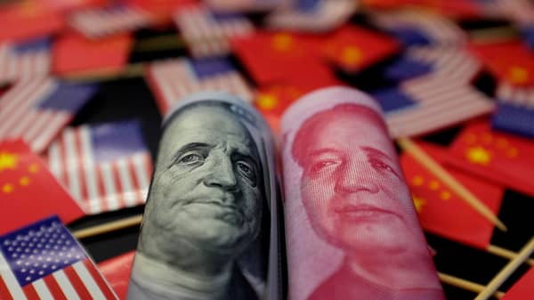 FILE PHOTO: Illustration picture showing U.S. dollar and China’s yuan banknotes