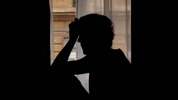 silhouette-of-lonely-depressive-man-crying-in-dark-room-camera-wiggle-movement_4j98mgdy__F0004