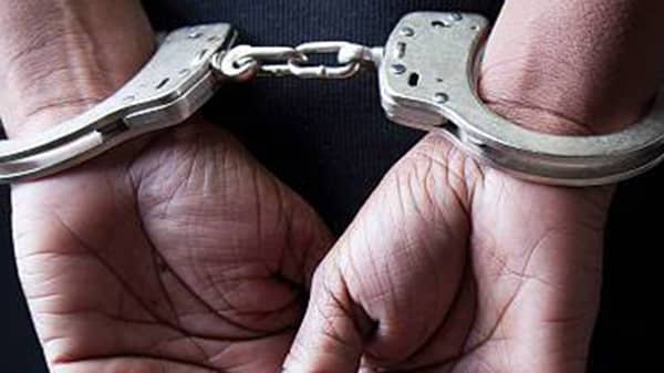 Black woman in handcuffs