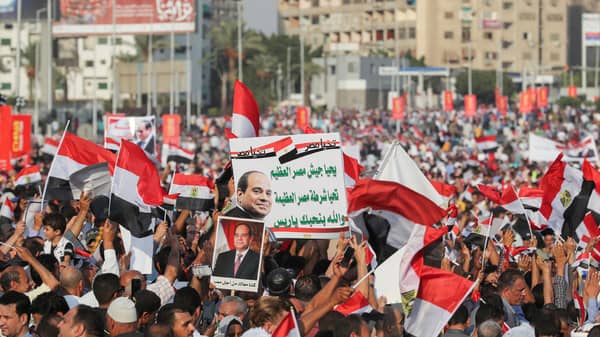 Egyptian President Abdel Fattah Al Sisi supporters chant slogans and raise flags and banners in Nasr City, Cairo