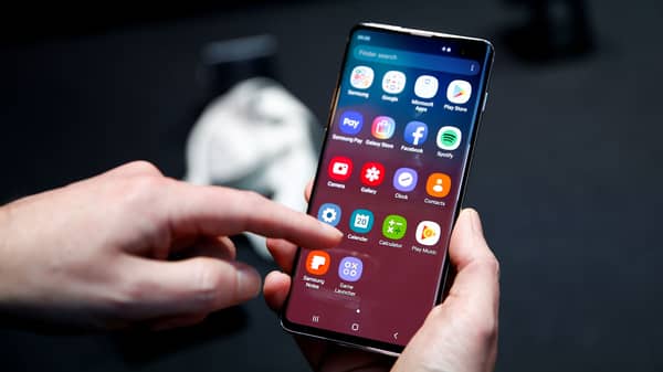 FILE PHOTO: A journalist uses the new Samsung Galaxy S10 smartphone at a press event in London