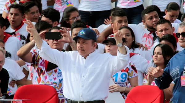 Nicaraguan President Daniel Ortega greets to supporters during an event celebrating the 40th anniversary of the Sandinista Revolution, at Juan Pablo II square in Managua