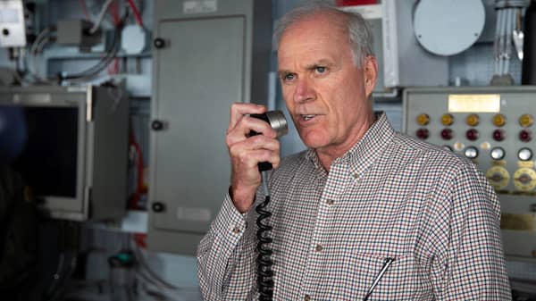 Secretary of the Navy Richard V. Spencer addresses the crew of the U.S. Navy aircraft carrier USS Gerald R. Ford