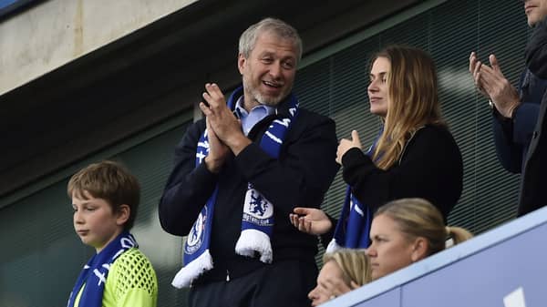 Chelsea owner Roman Abramovich applauds fans after winning the Premier League