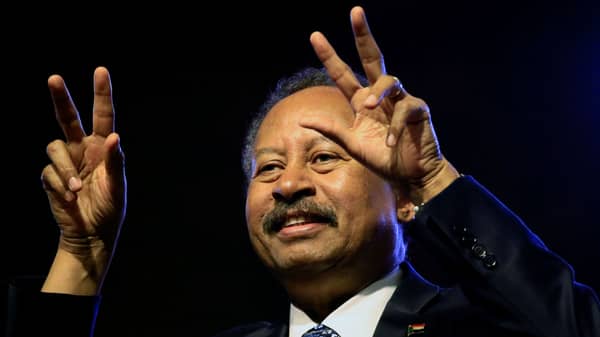 Sudan’s Prime Minister in the transitional government Abdalla Hamdok gestures the victory sign at the Friendship Hall in Khartoum