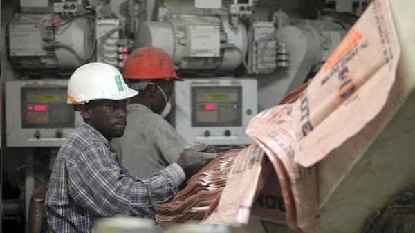 Personnel-maning-a-machine-at-a-Dangote-Cement-manufacturing-plant-in-Nigeria