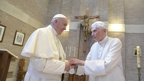 Pope Francis meets Emeritus Pope Benedict XVI during a meeting with five newly elevated Cardinals after a consistory at the Vatican