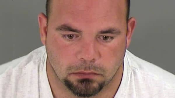 Rogers poses in jail booking photo in Henrico County