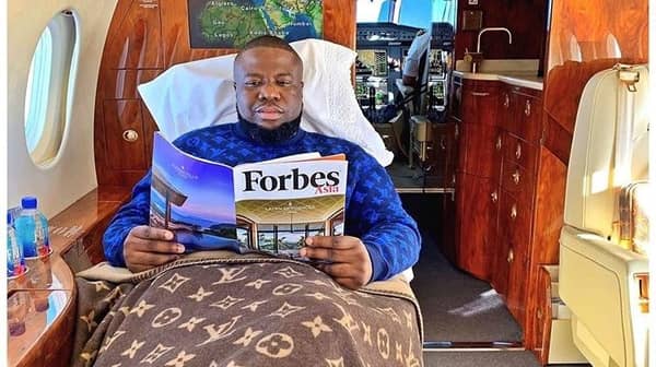 Hushpuppi displaying his ill-gotten wealth on his Instagram account draped in designer apparels.