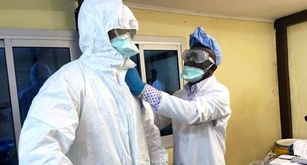 A medical staff wears protective gear at a new section specialised in receiving any person who may have been infected with coronavirus at The Quinquinie Hospital in Douala,