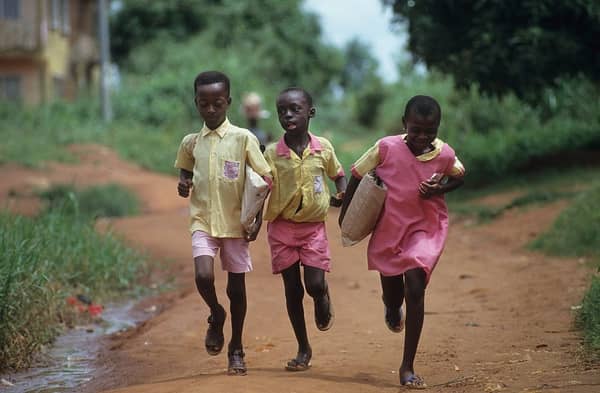 Primary schoolchildren in Benin City going to school. Photo by Universal Images Group