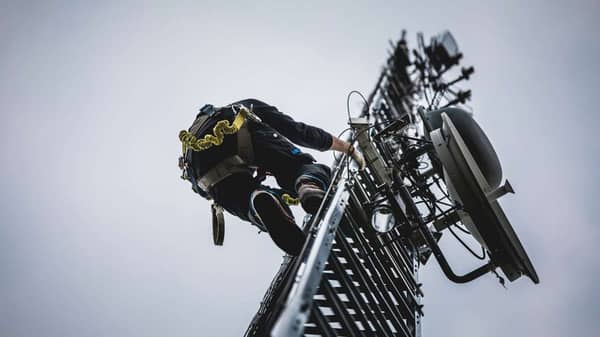 telecom-worker-climbing-antenna-tower-PEZMGB3