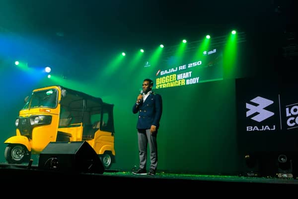 Okocha presenting the tricycle