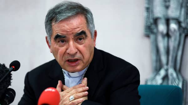 Cardinal Giovanni Angelo Becciu speaks to the media in Rome