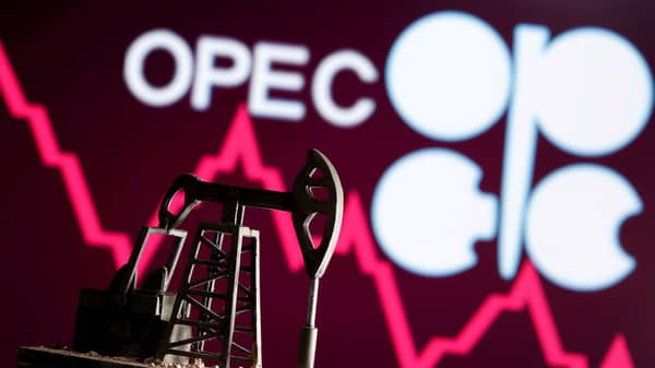 FILE PHOTO: A 3D printed oil pump jack is seen in front of displayed stock graph and Opec logo in this illustration picture