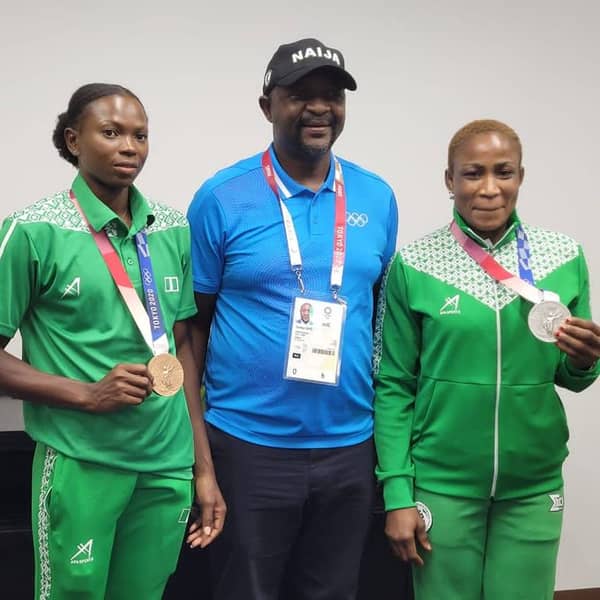 Nigerian athletes Blessing Oborududu and Ese Brume with sports minister Sunday Dare