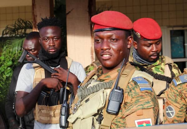 FILE PHOTO: Burkina Faso’s new military leader Ibrahim Traore is escorted by soldiers in Ouagadougou