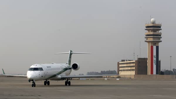 An Iraqi Airways plane lands at Baghdad International airport
