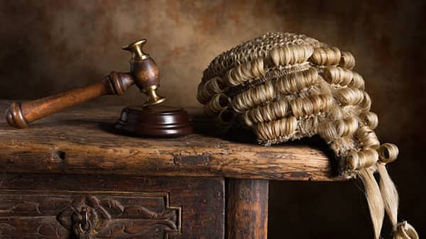 Judge’s court wig and hammer or gavel