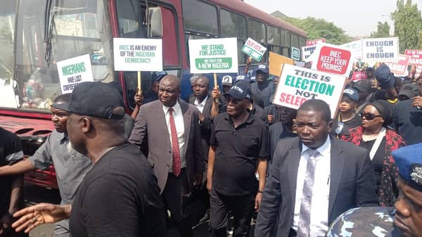 Atiku joins PDP protest at INEC office in Abuja.