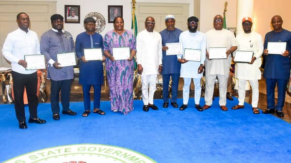 Pic 10. National Assembly Members-elect present CoR to Gov. Wike