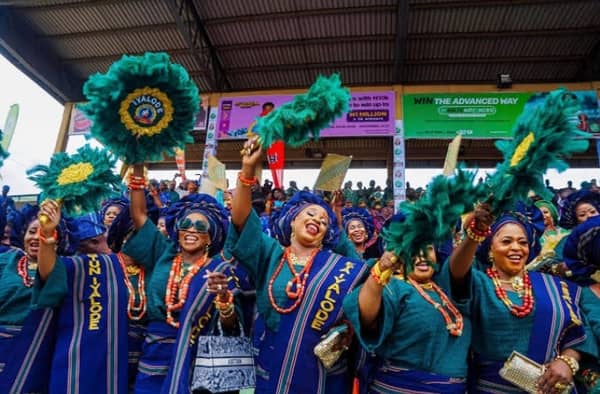 Women in blue and green at Ojude Oba festival