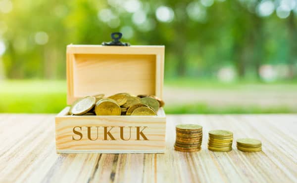 Business,Concept,:,”sukuk”,Word,On,Box,Over,Blur,And
