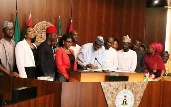 Buhari-signing-the-Not-Too-Young-To-Run-bill