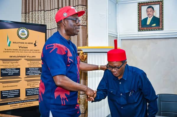 The Anambra State Commissioner for Information, Law Mefor and Governor Charles Soludo