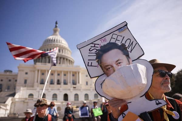 Protesters Rally Against GOP Spending Cuts And DOGE At The U.S. Capitol