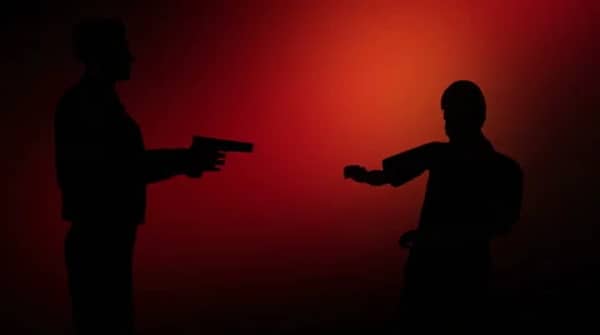 man-pointing-gun-against-flashing-footage-059713619_iconl