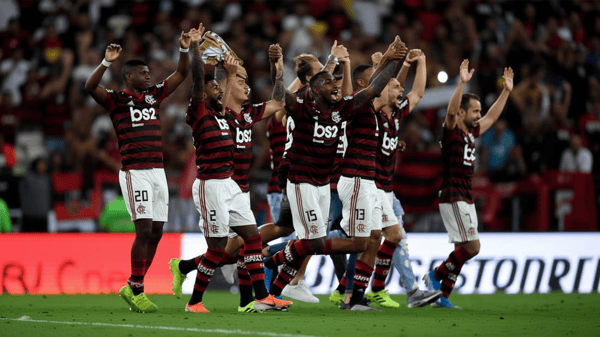 Flamengo’s players celebrate after defeating Gremio during their Copa Libertadores semi-final second leg football match, at Maracana Stadium in Rio de Janeiro… on Wednesday.