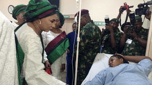 NAOWA President, Safiyyah Hassan Shaibu (left) with a patient during the tour of the hospital