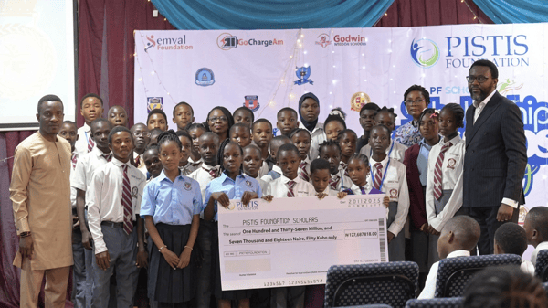 Some beneficiaries of the scholarship scheme with officials of Pistine Foundation at the prize presentation