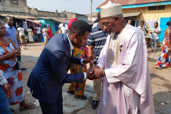 Nigerians shaking hands