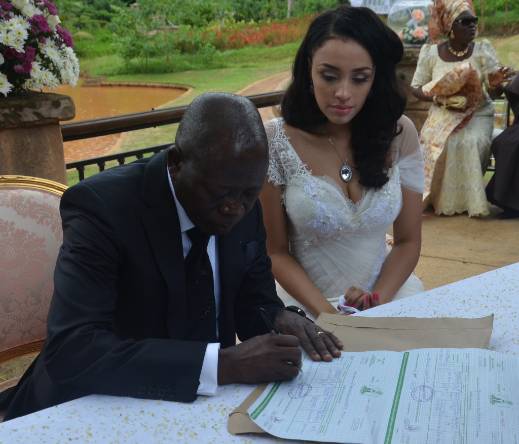 Governor Adams Oshiomole signs the dotted lines at the wedding