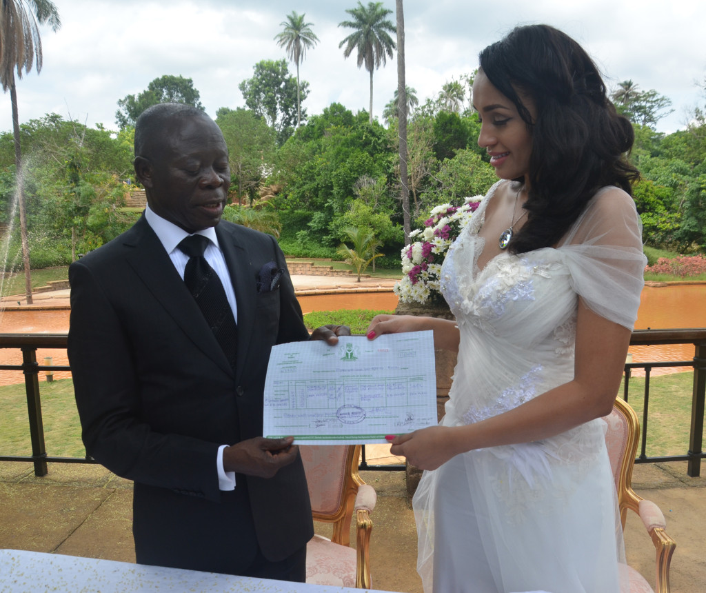 Mr. and Mrs Adams Oshiomole display their wedding certificate