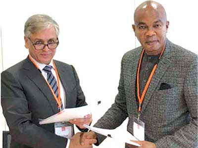 Chairman of Cummins Cogeneration Ltd, Deepak Khilani (left); and Chairman of Sapele Power Plc, Anthony Onoh, at the signing of power purchase agreement between the two companies, in London. 