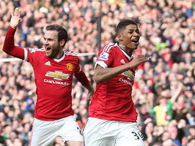 I have done it…Manchester United young striker Marcus Rashford (right) celebrates with teammate, Mata, after scoring a brace against Arsenal at the Old Trafford yesterday. Photo: Getty Images